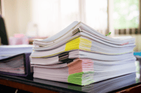 stack of organized lease documents