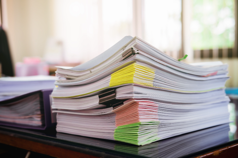 stack of organized lease documents
